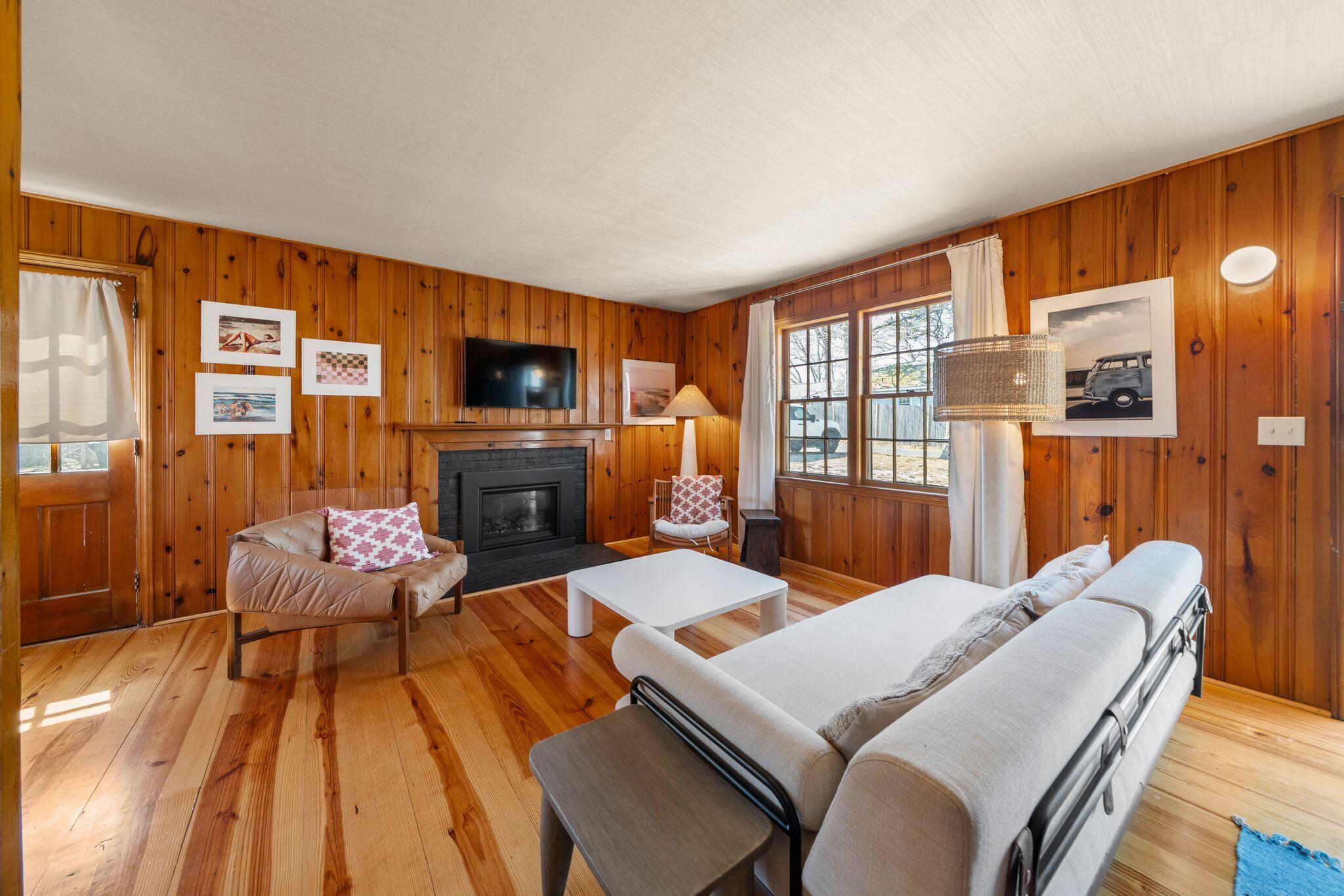 18 Manning Road Dennis Port, MA 02639 - Photo 6 of 34 a living room with fireplace furniture and a flat screen tv