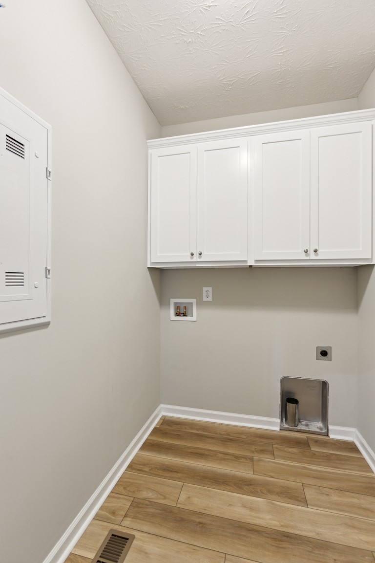 5129 Galen Road Lafayette, TN 37083 - Photo 16 of 25 a view of a utility room with wooden floor