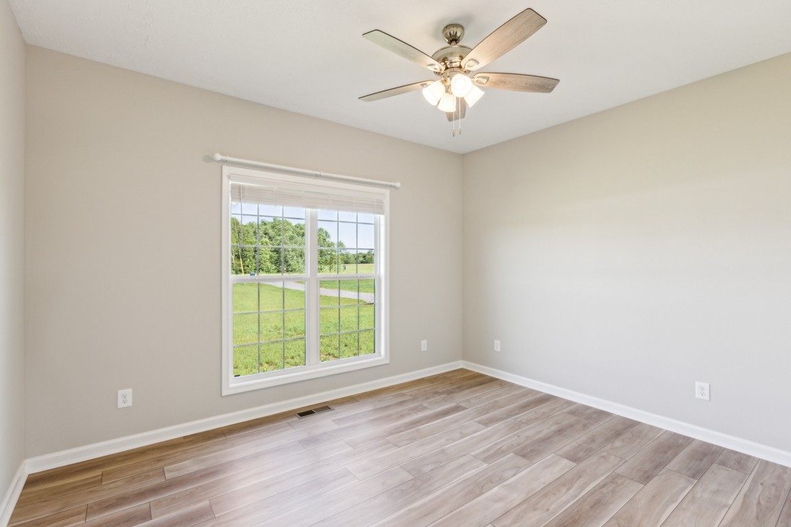 5129 Galen Road Lafayette, TN 37083 - Photo 19 of 25 wooden floor in an empty room with a window