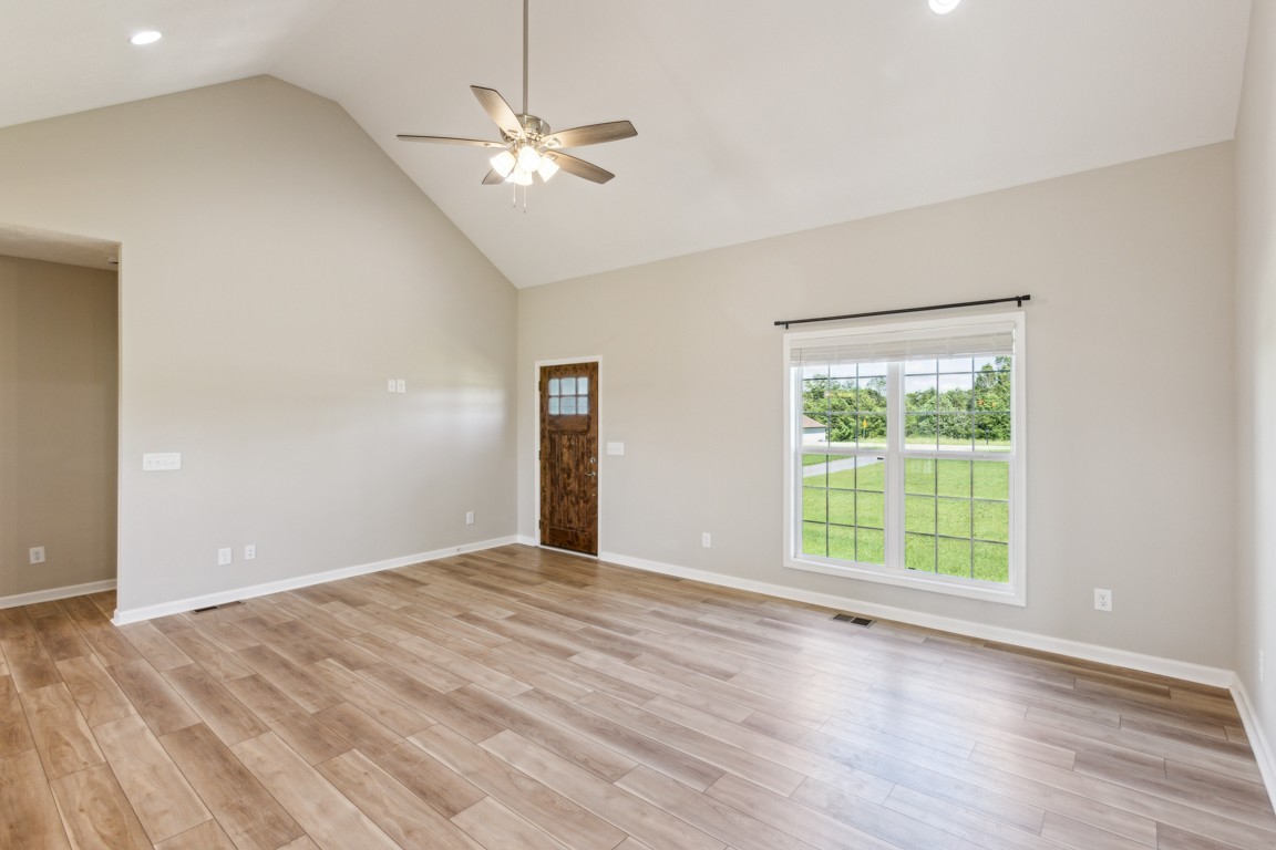 5129 Galen Road Lafayette, TN 37083 - Photo 6 of 25 a view of an empty room with a window and wooden floor