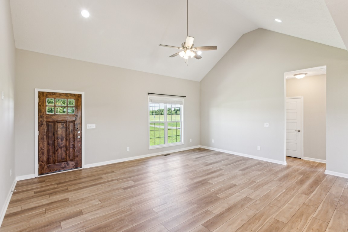 5129 Galen Road Lafayette, TN 37083 - Photo 7 of 25 a view of an empty room with wooden floor and a window