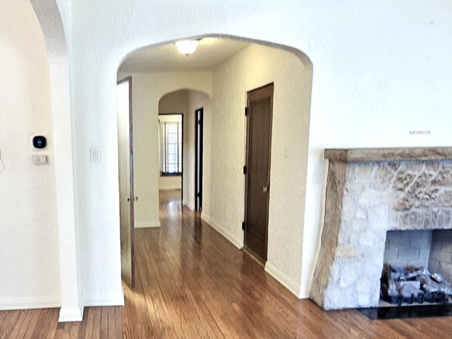 410 North Raynor Avenue, Unit 1W Joliet, IL 60435 - Photo 12 of 64 a view of a living room with wooden floor