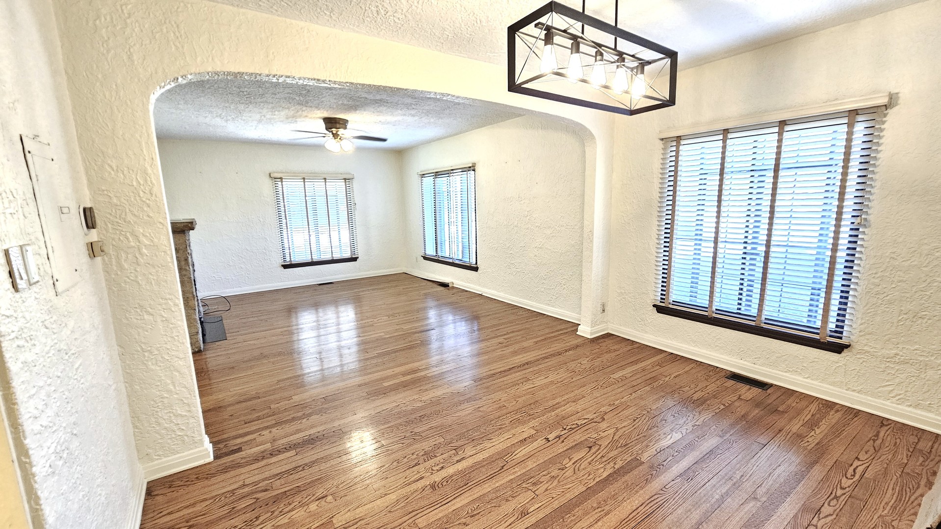 410 North Raynor Avenue, Unit 1W Joliet, IL 60435 - Photo 26 of 64 a view of a hallway with wooden floor and staircase