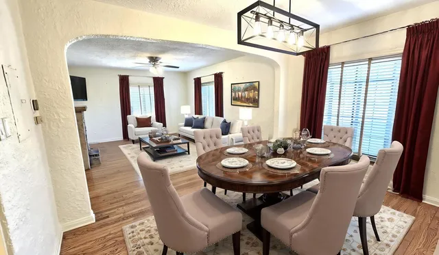 a view of a dining room with furniture window and outside view