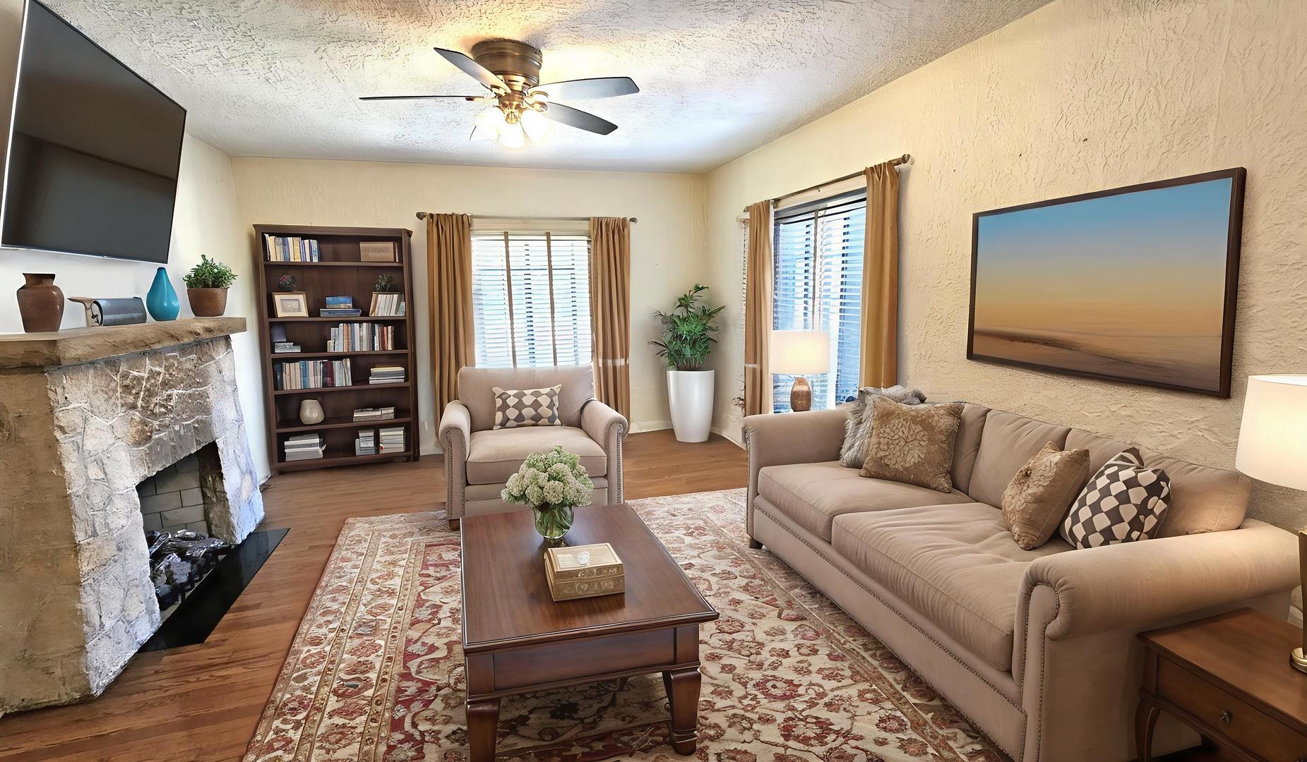 410 North Raynor Avenue, Unit 1W Joliet, IL 60435 - Photo 29 of 64 a living room with furniture a fireplace and a flat screen tv