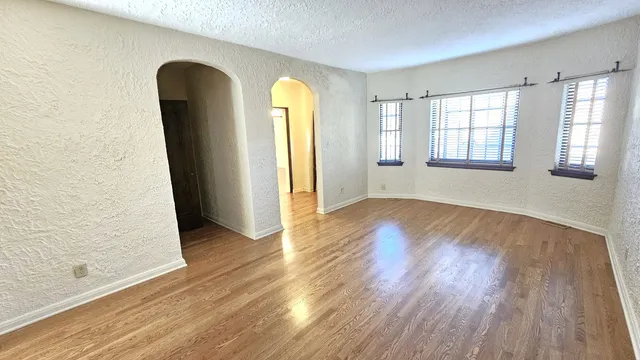a bathroom with a double vanity sink a mirror and a shower