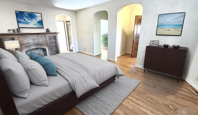 a view of a room with wooden floor and chandelier