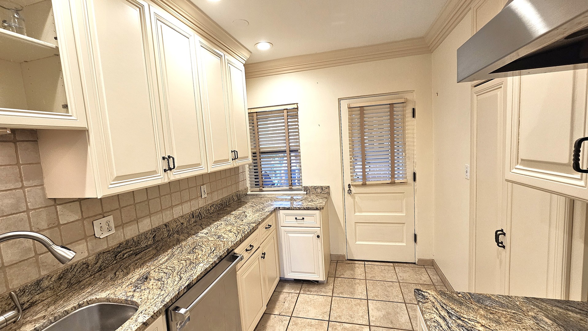 410 North Raynor Avenue, Unit 1W Joliet, IL 60435 - Photo 54 of 64 a spacious bathroom with a granite countertop sink and a bathtub