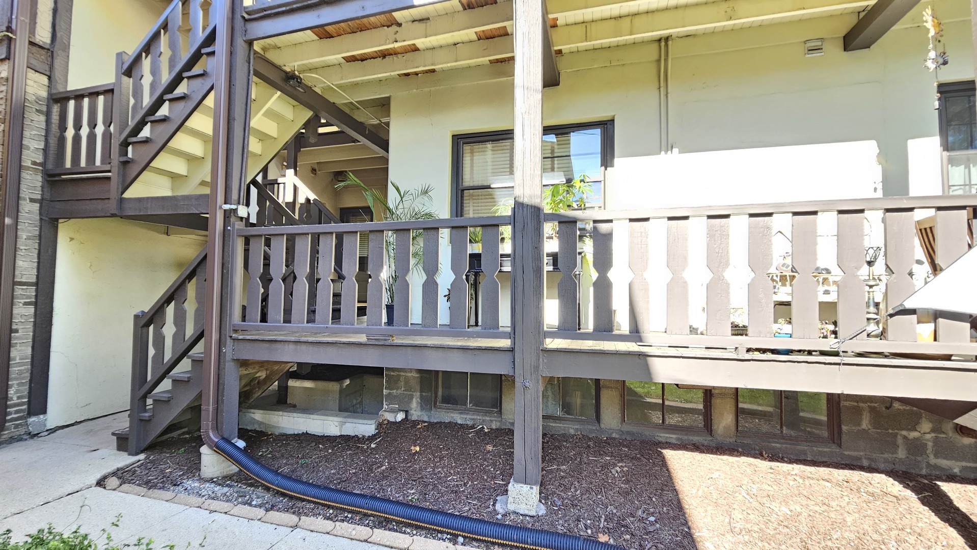 410 North Raynor Avenue, Unit 1W Joliet, IL 60435 - Photo 59 of 64 a view of a balcony with small garden