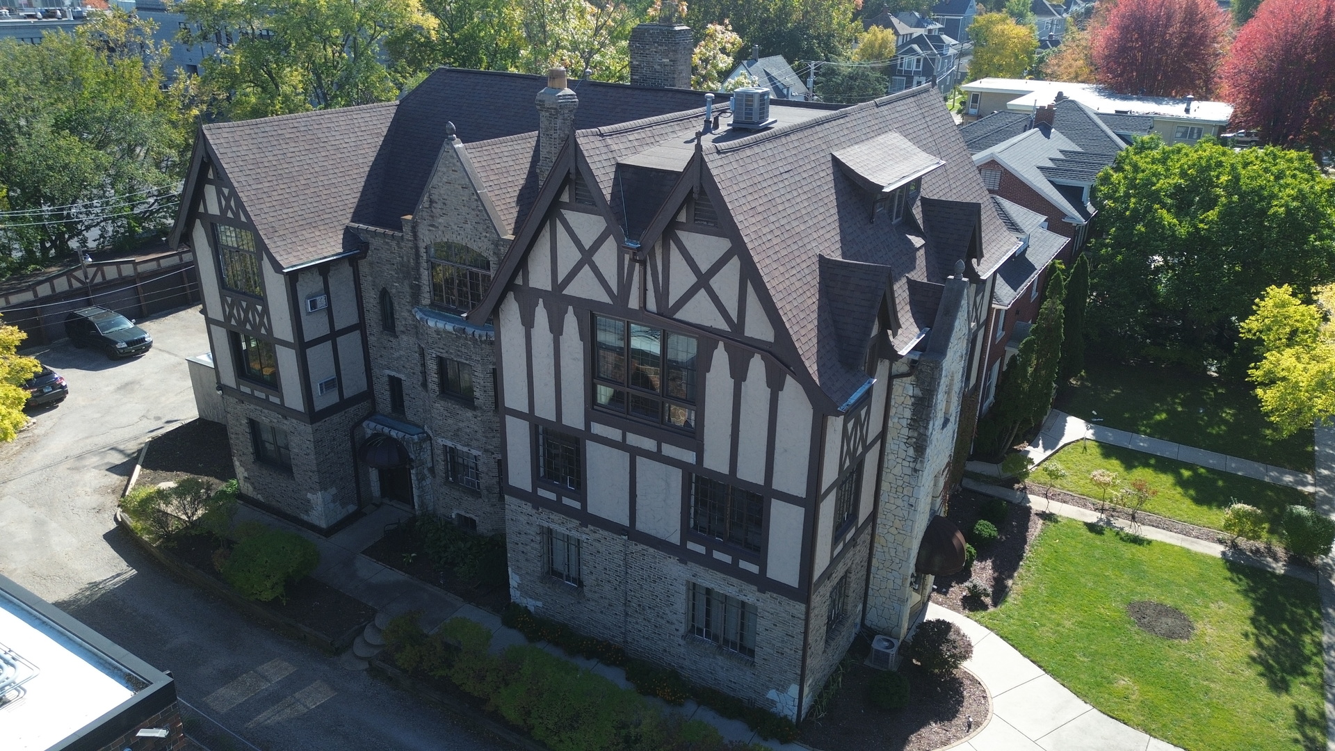 410 North Raynor Avenue, Unit 1W Joliet, IL 60435 - Photo 62 of 64 an aerial view of a house with backyard and trees