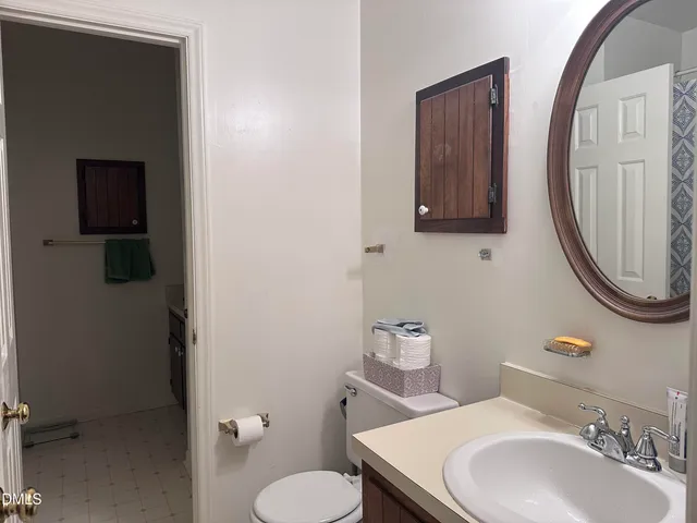 a bathroom with a shower curtain