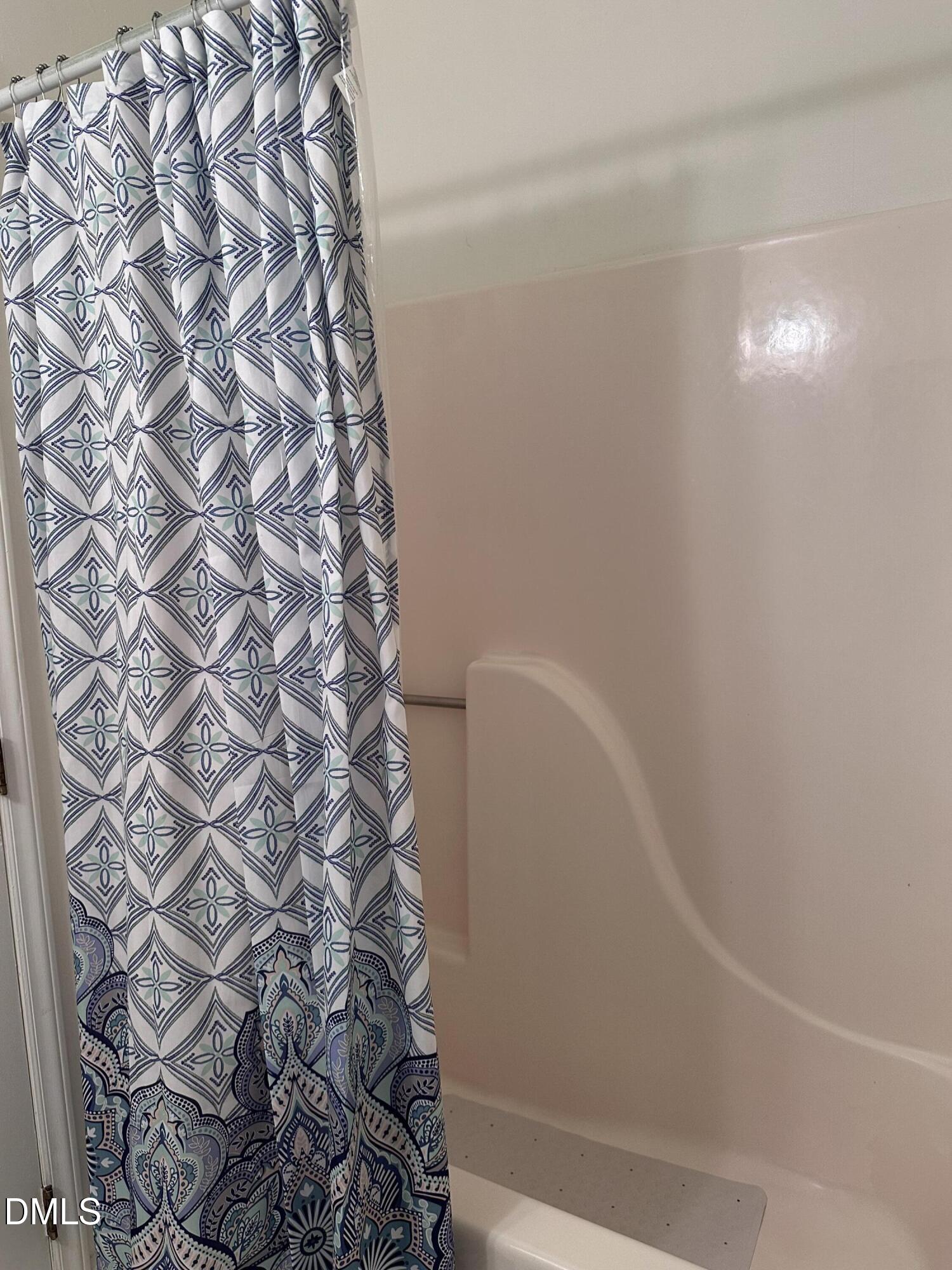 1440 Kent Road Raleigh, NC 27606 - Photo 17 of 21 a bathroom with a shower curtain