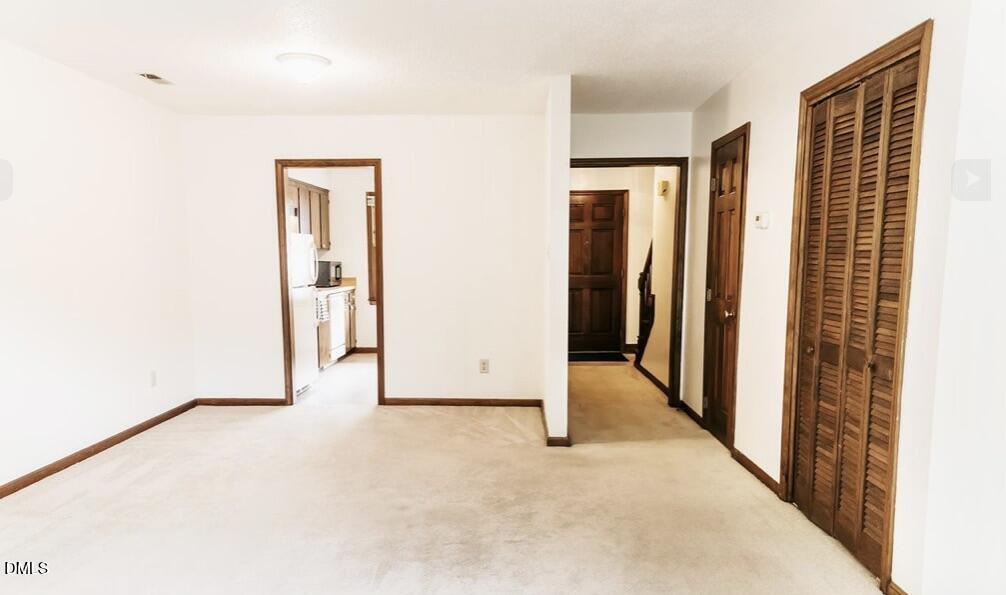 1440 Kent Road Raleigh, NC 27606 - Photo 2 of 13 a view of an empty room with a window