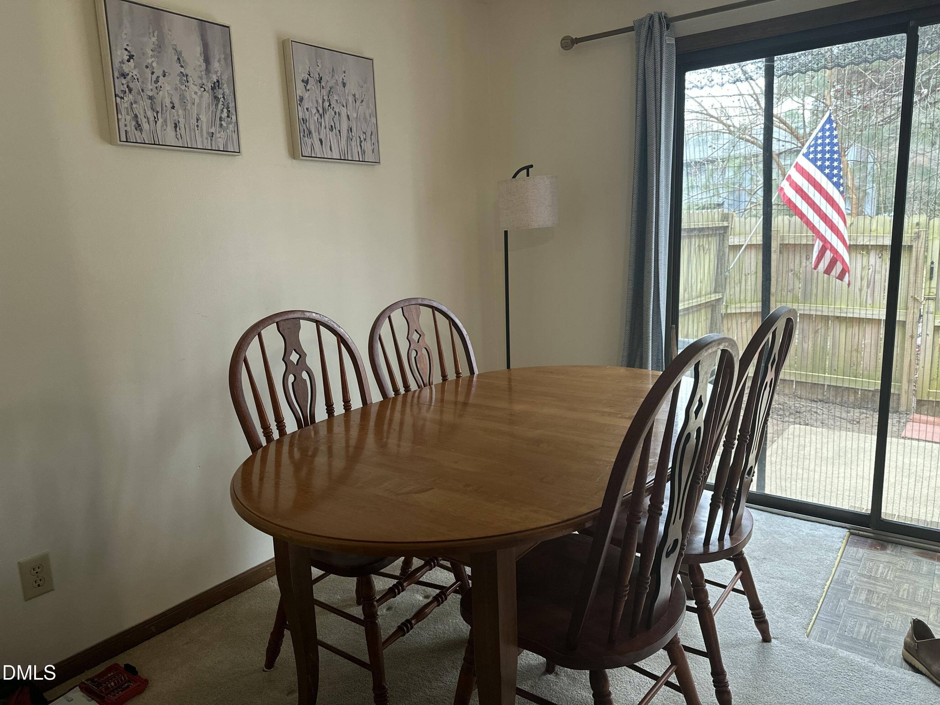 1440 Kent Road Raleigh, NC 27606 - Photo 4 of 13 a view of a dining room with furniture window and outside view