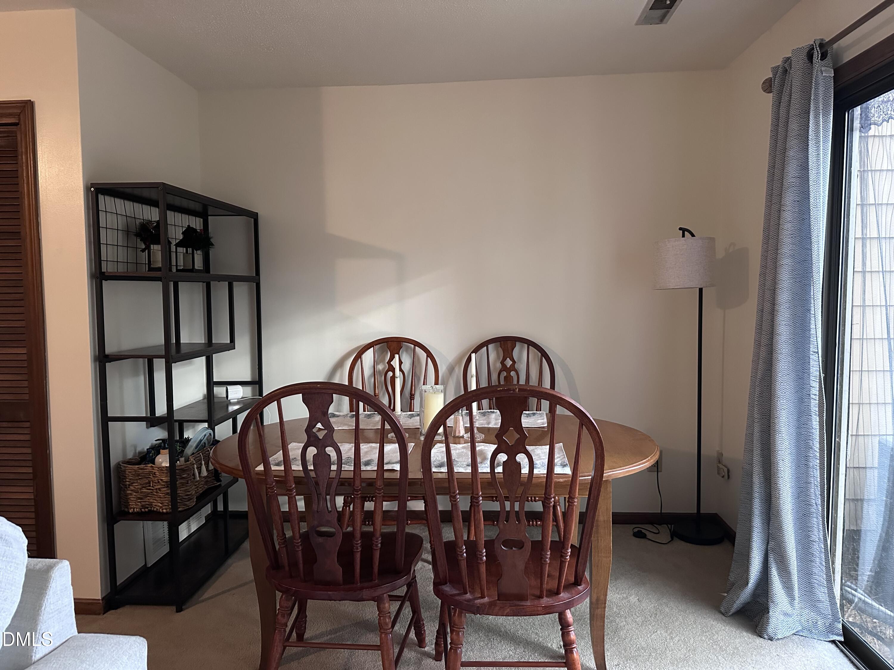 1440 Kent Road Raleigh, NC 27606 - Photo 5 of 21 a view of a dining room with furniture