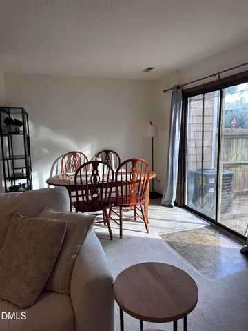 a kitchen with a sink a refrigerator and cabinets