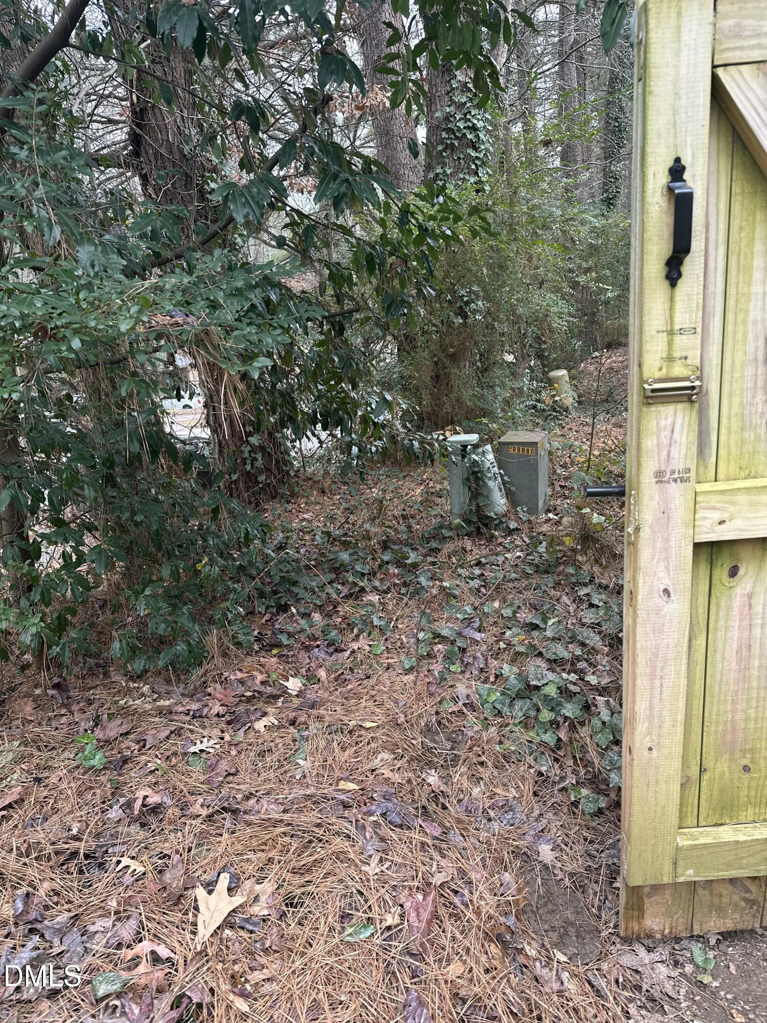 1440 Kent Road Raleigh, NC 27606 - Photo 7 of 13 a view of a house with a tree