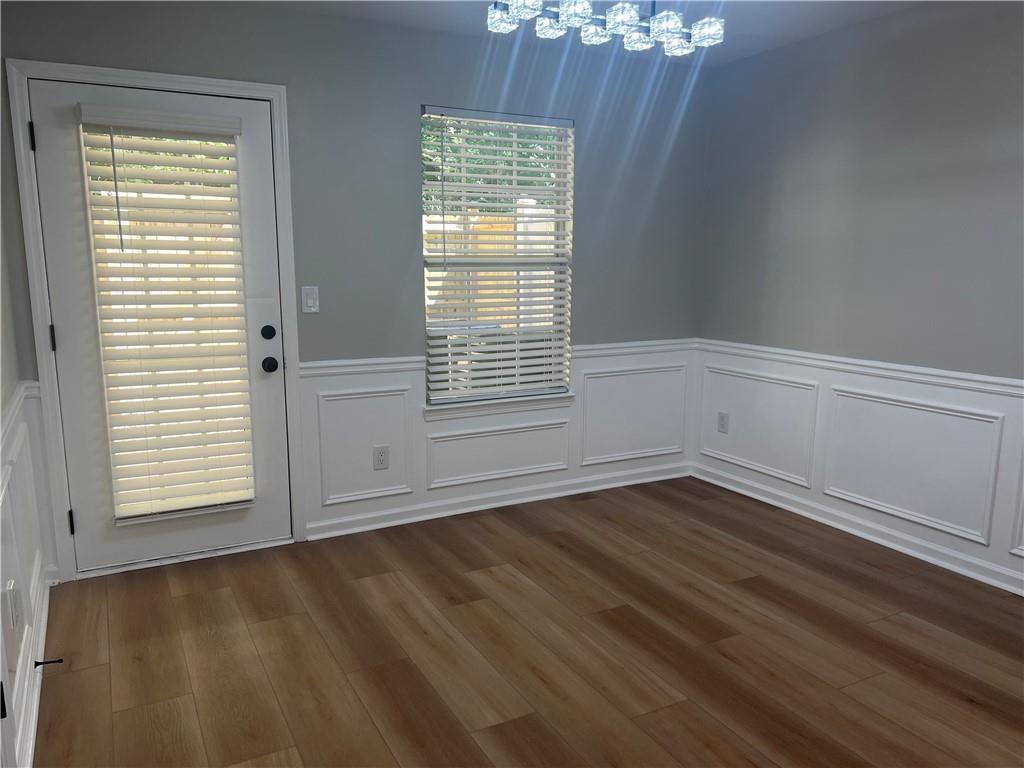 2896 Vining Ridge Terrace Decatur, GA 30034 - Photo 13 of 24 an empty room with wooden floor and windows