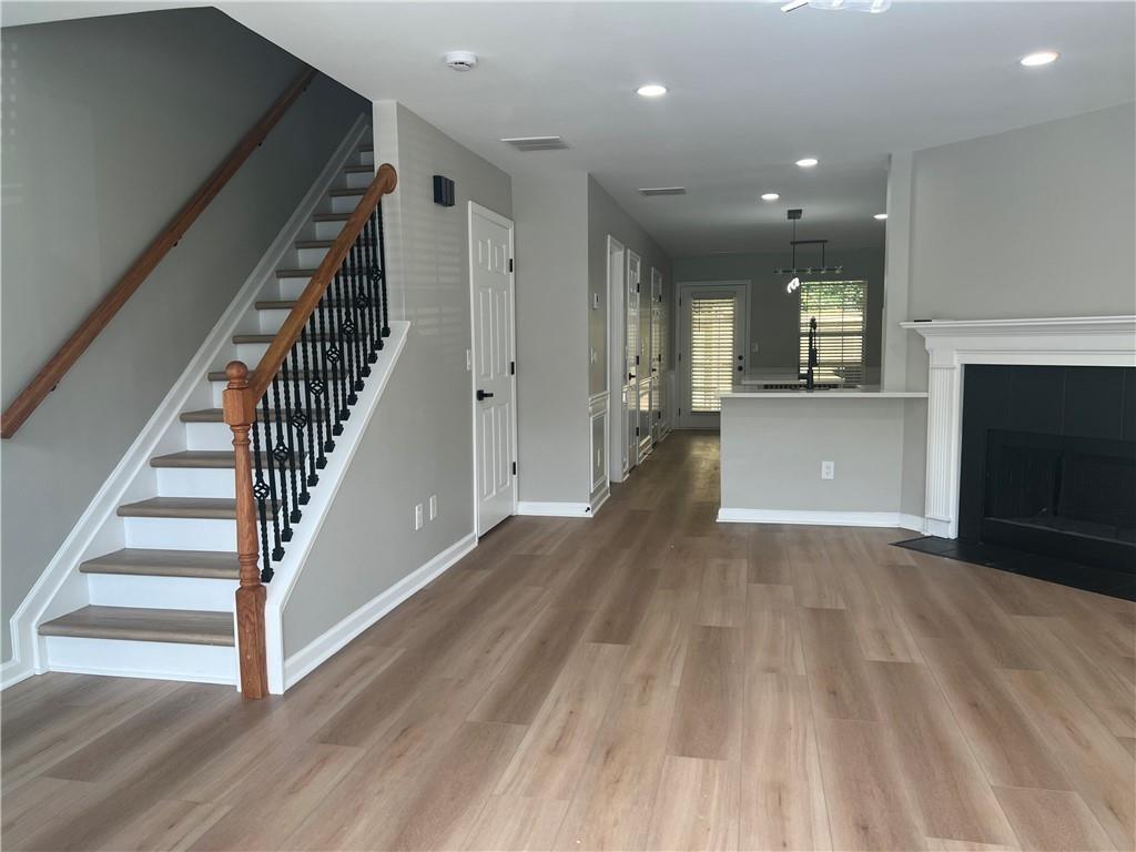 2896 Vining Ridge Terrace Decatur, GA 30034 - Photo 3 of 24 wooden floor in an empty room with a fireplace