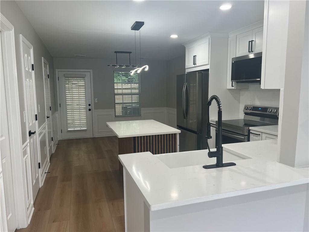 2896 Vining Ridge Terrace Decatur, GA 30034 - Photo 9 of 24 a kitchen with stainless steel appliances and a refrigerator