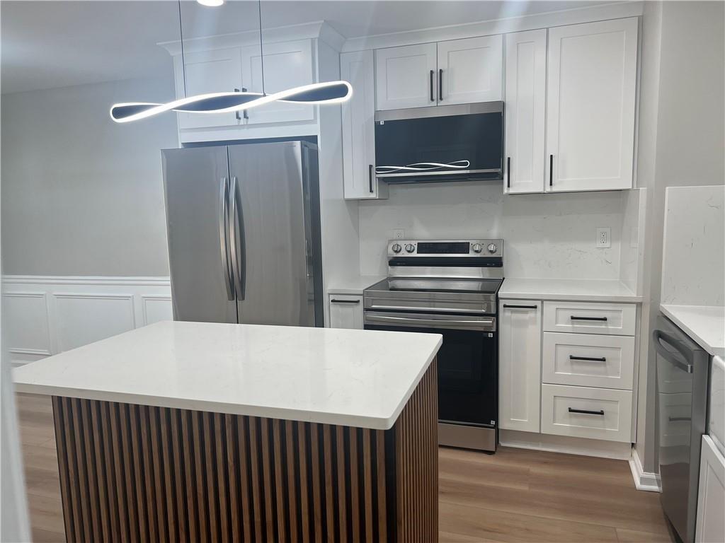 2896 Vining Ridge Terrace Decatur, GA 30034 - Photo 10 of 24 a kitchen with a refrigerator and a stove top oven