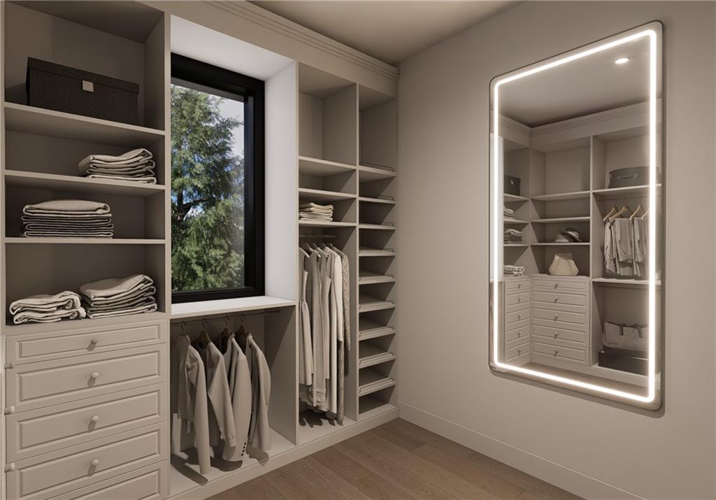 6240 Stewart Road Buford, GA 30518 - Photo 12 of 26 a view of walk in closet with clothes and shoes