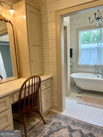 a bathroom with a toilet a sink and bathtub