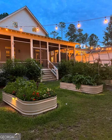 a front view of house with yard and outdoor seating