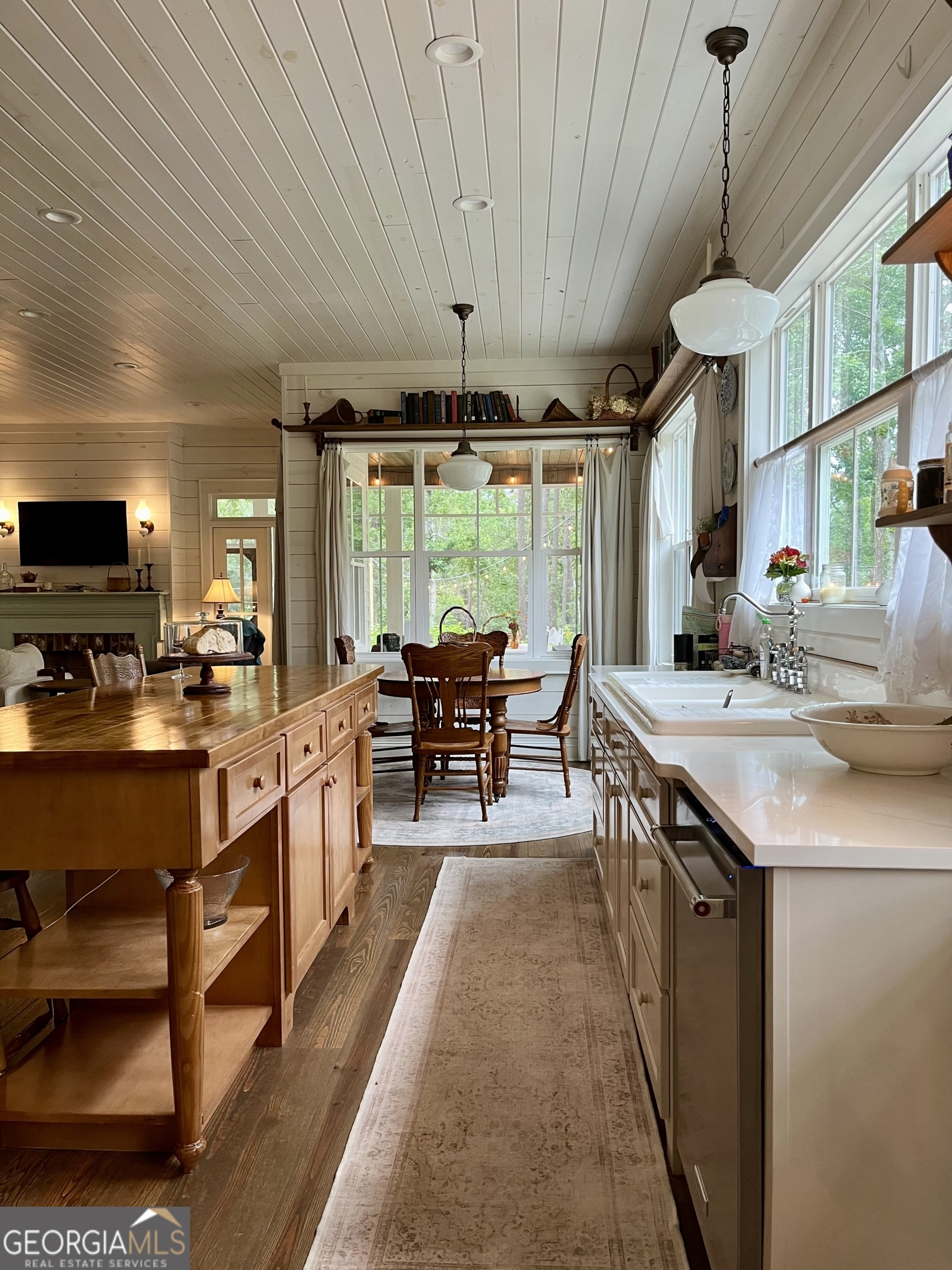 182 Rogers Street Hazlehurst, GA 31539 - Photo 31 of 38 a open kitchen with stainless steel appliances granite countertop a sink a stove and a refrigerator