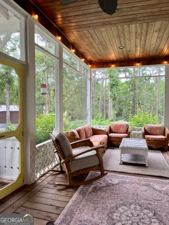 a outdoor living space with patio furniture and a potted plant