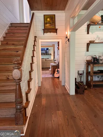 a view of entryway with wooden floor