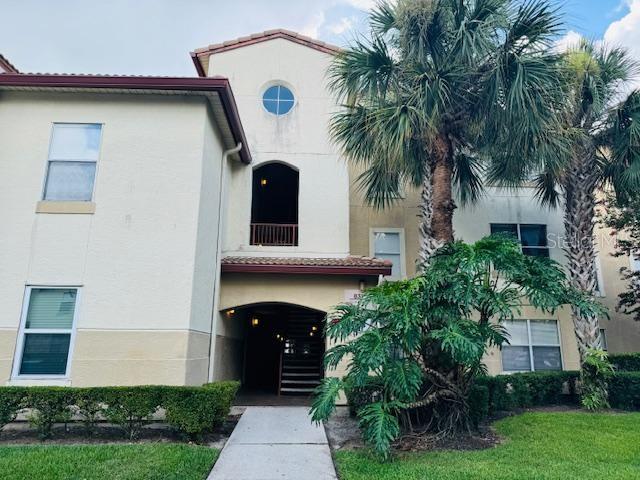 831 Camargo Way, Unit 206 Altamonte Springs, FL 32714 - Photo 1 of 1 a front view of a house with a garden