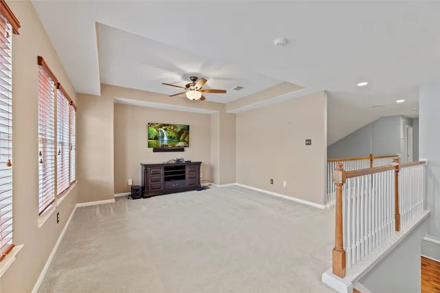 a view of livingroom with furniture and chandelier fan