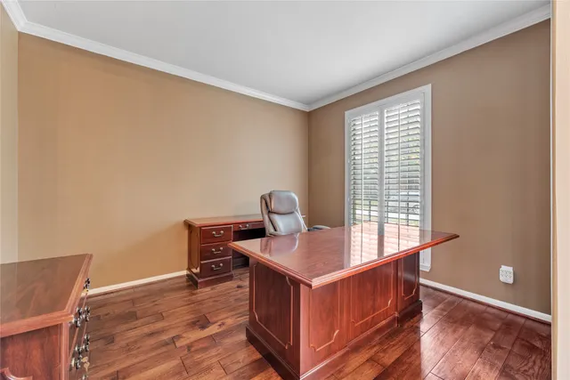 a room with a window and wooden floor