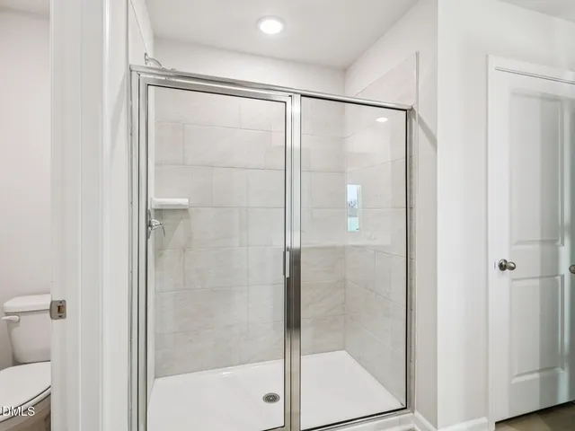 a bathroom with a sink double vanity and a mirror