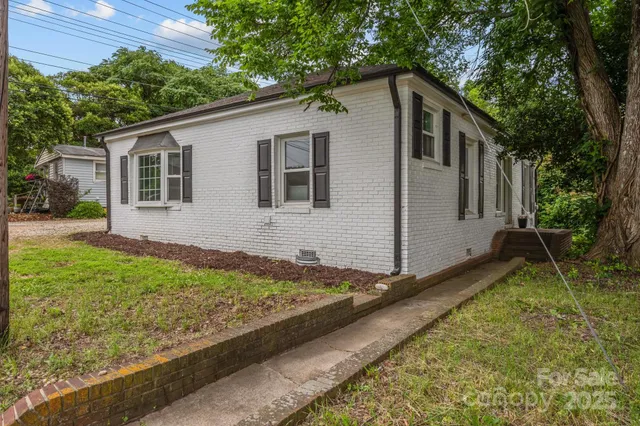 a backyard of a house with seating space