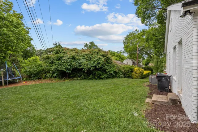 a backyard of a house with lots of green space