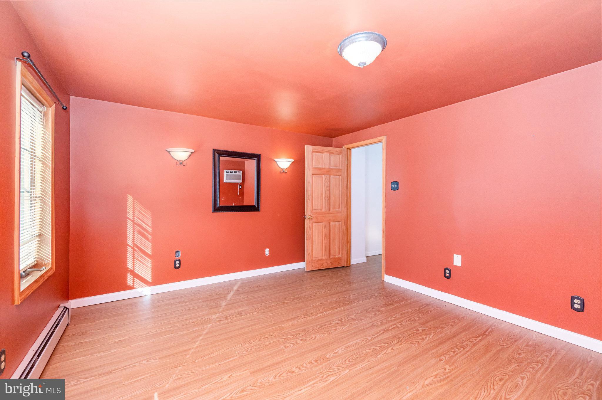 49 Main Street Pine Grove, PA 17963 - Photo 12 of 38 a view of an empty room with window and wooden floor