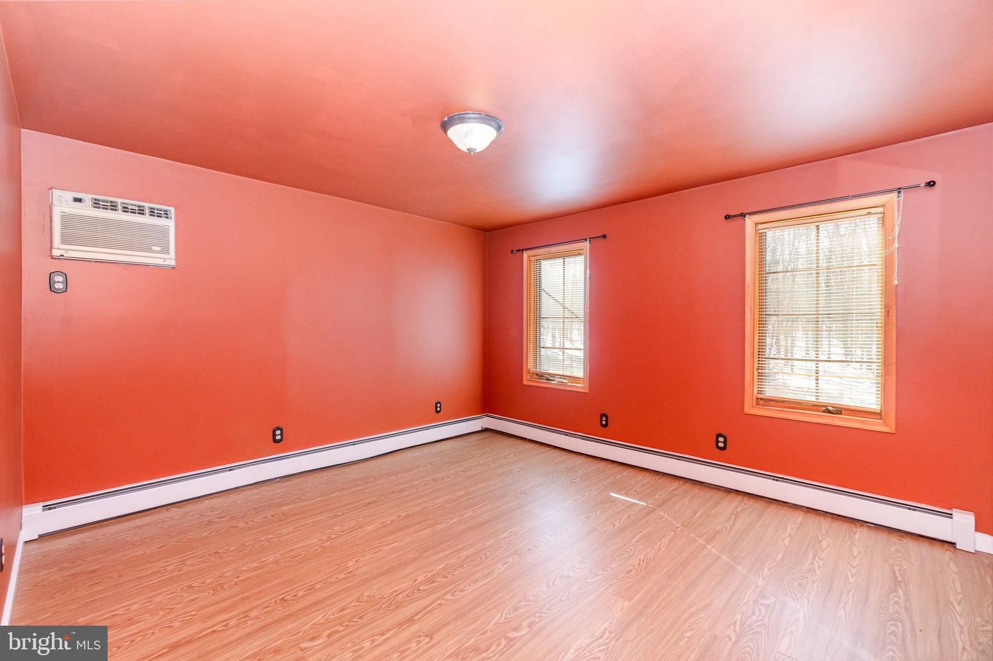 49 Main Street Pine Grove, PA 17963 - Photo 13 of 38 an empty room with wooden floor and windows