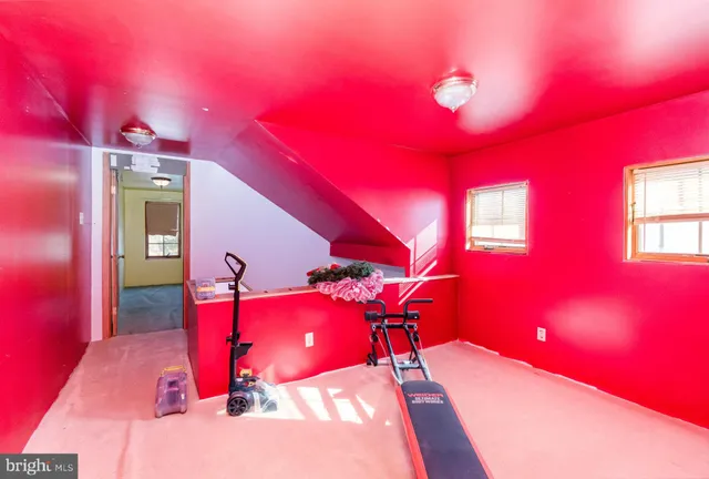 a view of a room with furniture and chandelier