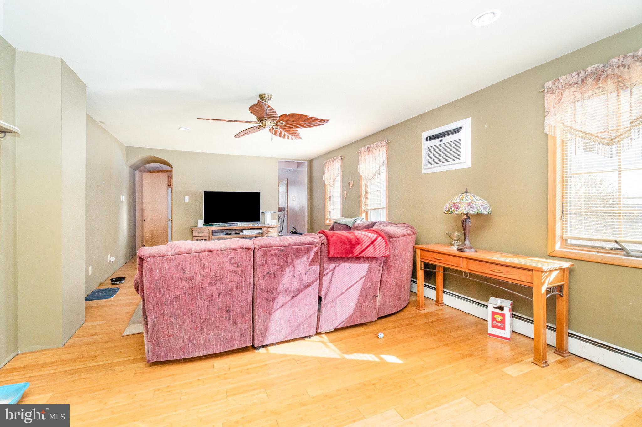49 Main Street Pine Grove, PA 17963 - Photo 8 of 38 a living room with furniture a flat screen tv and a window