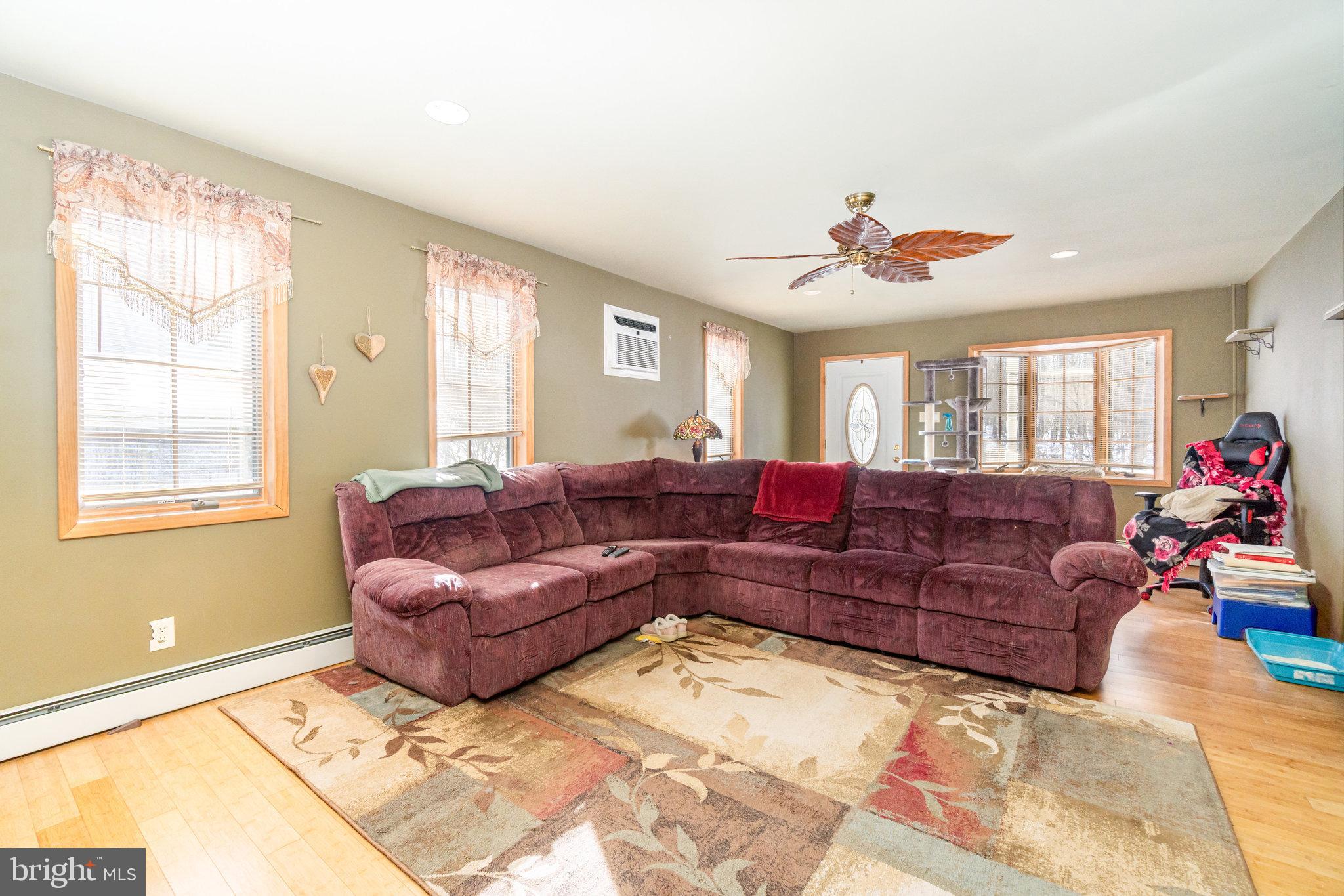 49 Main Street Pine Grove, PA 17963 - Photo 9 of 38 a living room with a couch and a chandelier
