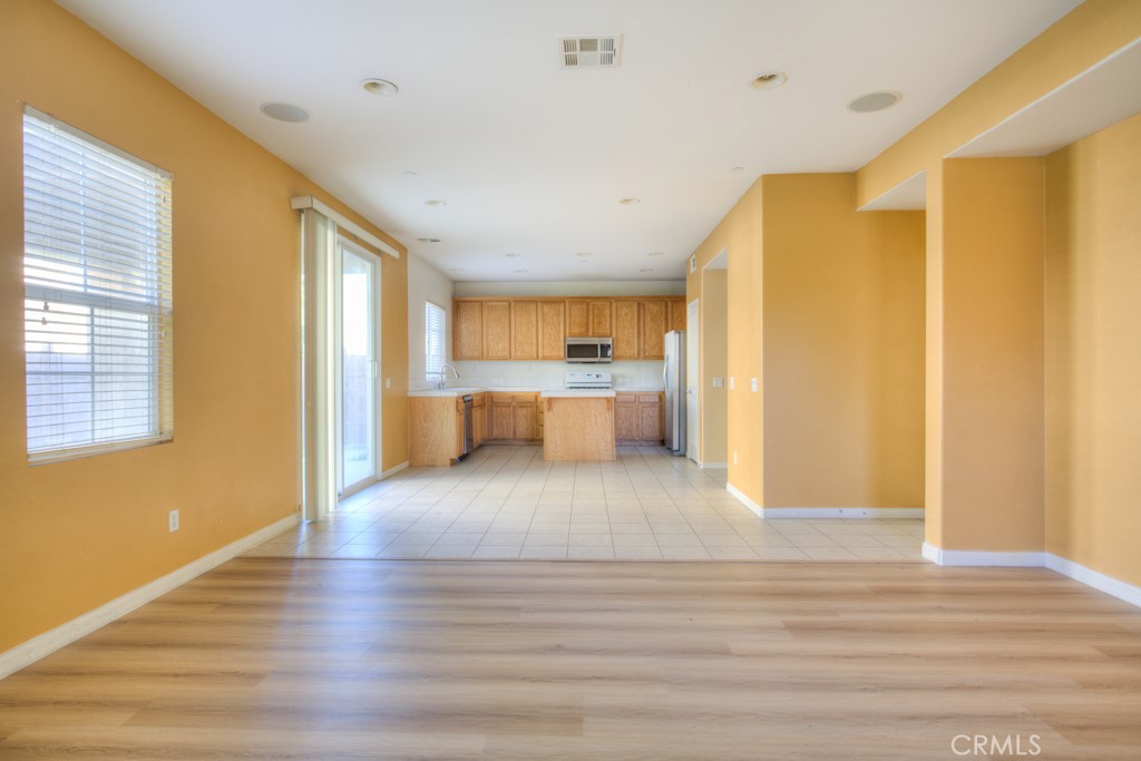 4587 Vincent Way Riverside, CA 92501 - Photo 15 of 51 a view of a kitchen with wooden floor and a window