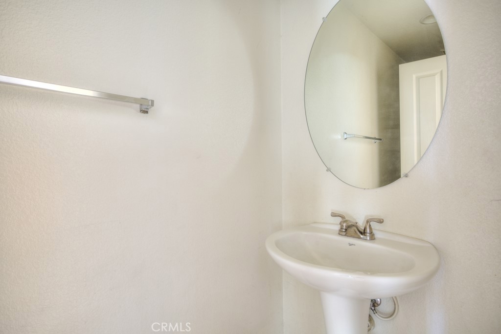 4587 Vincent Way Riverside, CA 92501 - Photo 17 of 51 a bathroom with a sink and a mirror