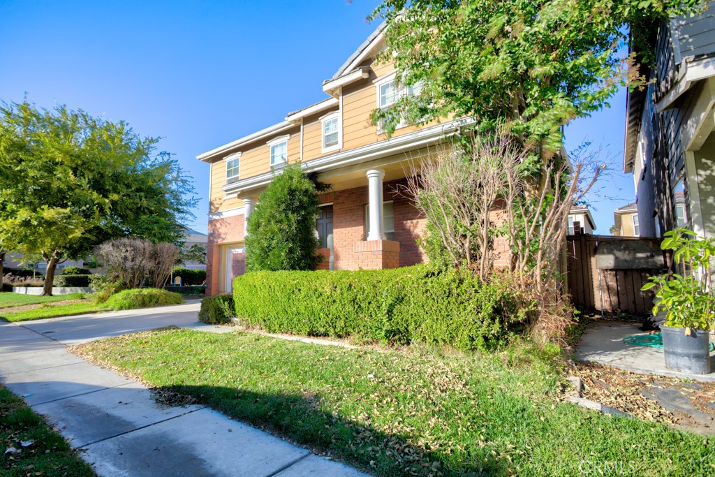 4587 Vincent Way Riverside, CA 92501 - Photo 2 of 51 a view of a house with a yard and plants