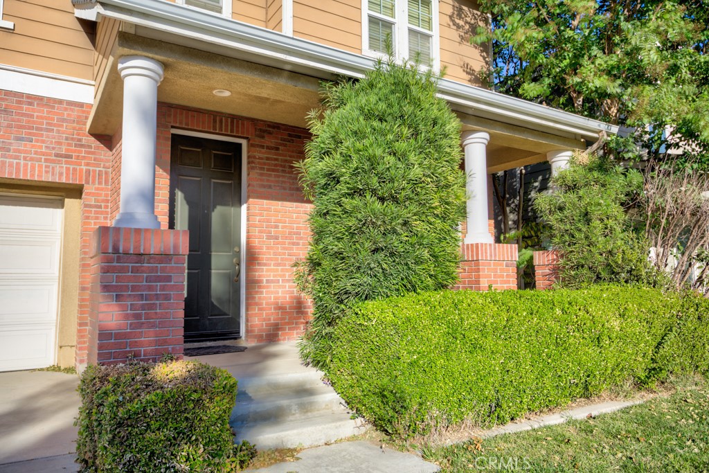 4587 Vincent Way Riverside, CA 92501 - Photo 3 of 51 front view of a house with potted plants