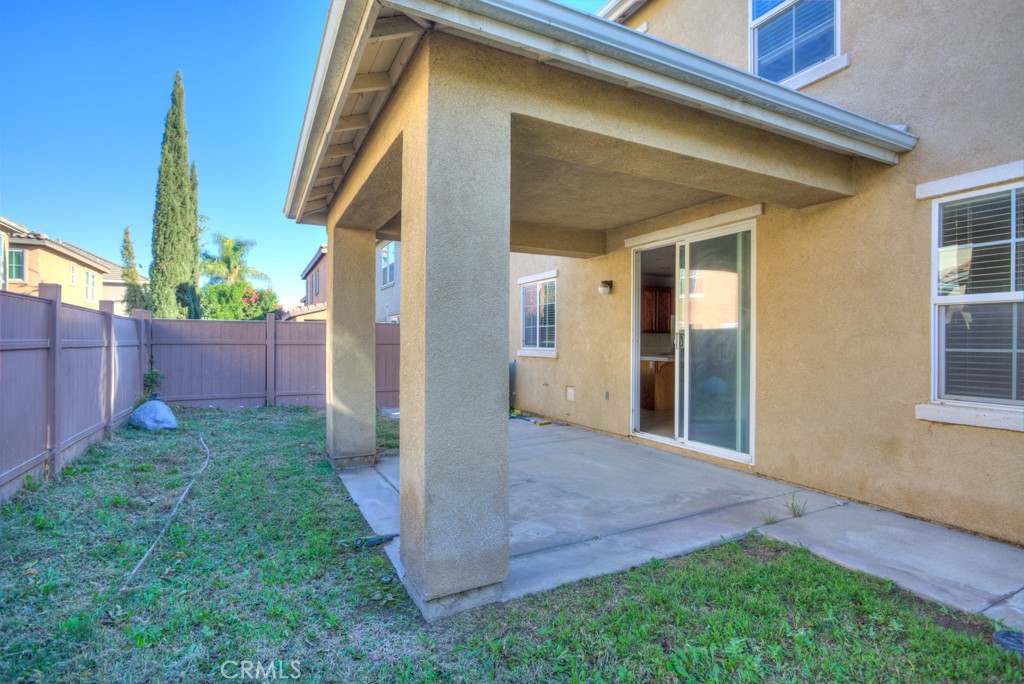 4587 Vincent Way Riverside, CA 92501 - Photo 45 of 51 a view of a house with a yard and wooden fence