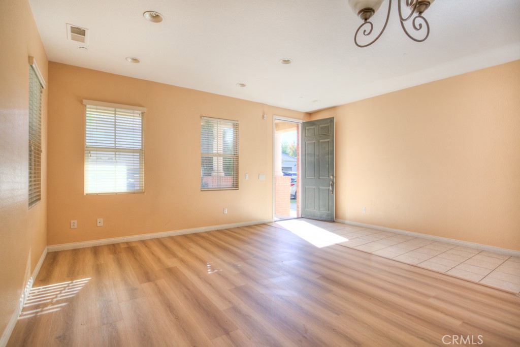 4587 Vincent Way Riverside, CA 92501 - Photo 5 of 51 a view of empty room with wooden floor and fan
