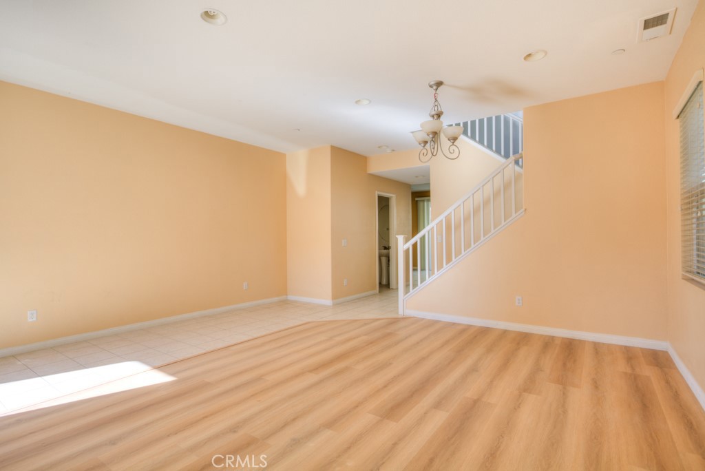 4587 Vincent Way Riverside, CA 92501 - Photo 6 of 51 a view of a room with wooden floor