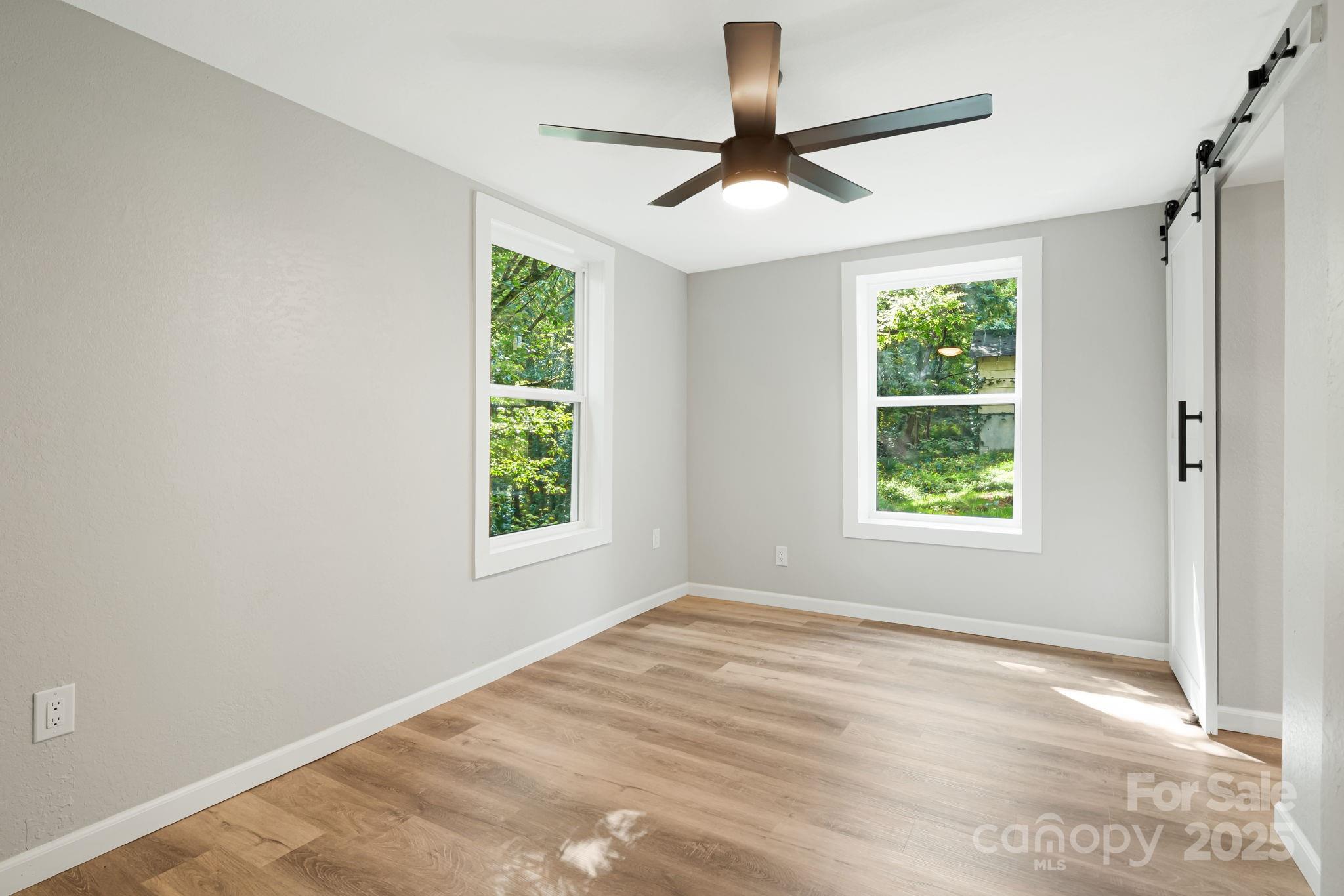 95 Grassy View Road Candler, NC 28715 - Photo 13 of 27 a view of an empty room with a window